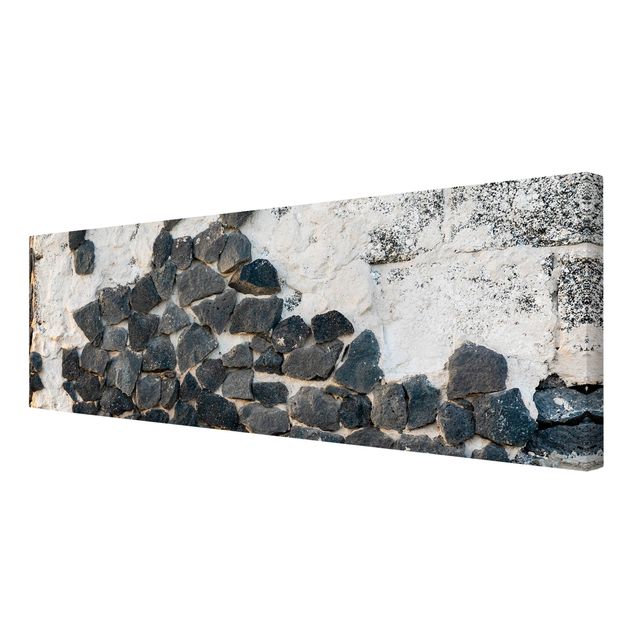 Leinwandbild - Mauer mit Schwarzen Steinen - Panorama 1:3