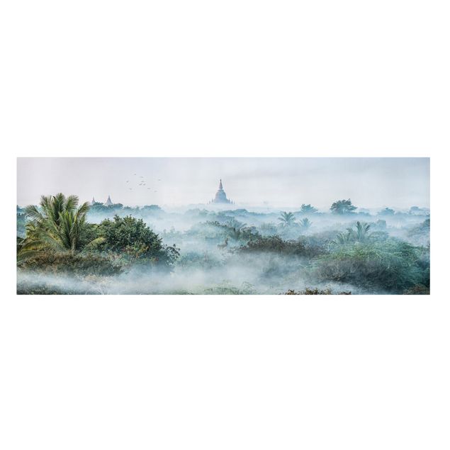 Leinwandbild - Morgennebel über dem Dschungel von Bagan - Panorama 3:1
