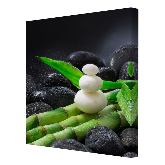 Leinwandbild - Weiße Steine auf Bambus - Quadrat 1:1