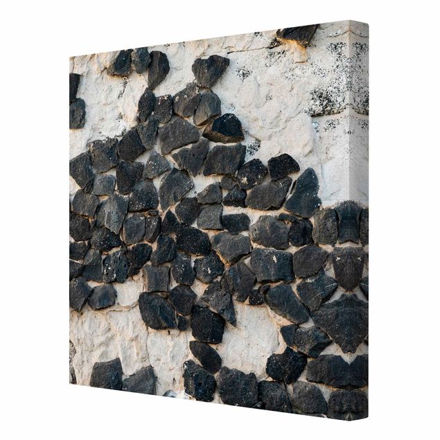 Leinwandbild - Mauer mit Schwarzen Steinen - Quadrat 1:1