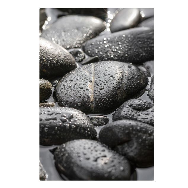 Leinwandbild - Schwarze Steine im Wasser - Hochformat 3:2