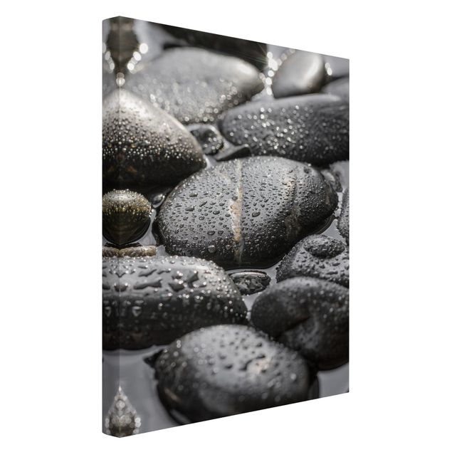 Leinwandbild - Schwarze Steine im Wasser - Hochformat 3:2