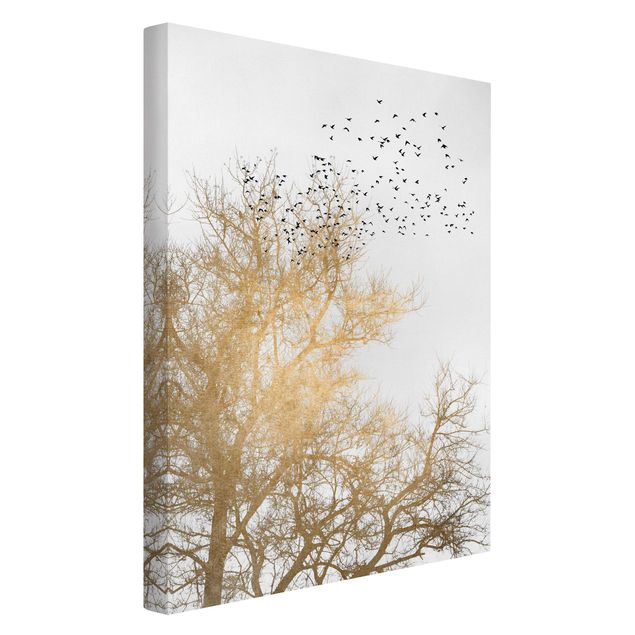Leinwandbild - Vogelschwarm vor goldenem Baum - Hochformat 3:2