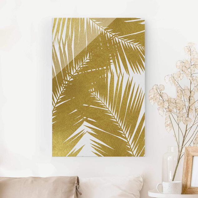 Magnettafel Glas Blick durch goldene Palmenblätter