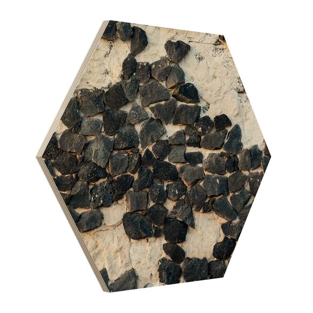 Hexagon Bild Holz - Mauer mit Schwarzen Steinen