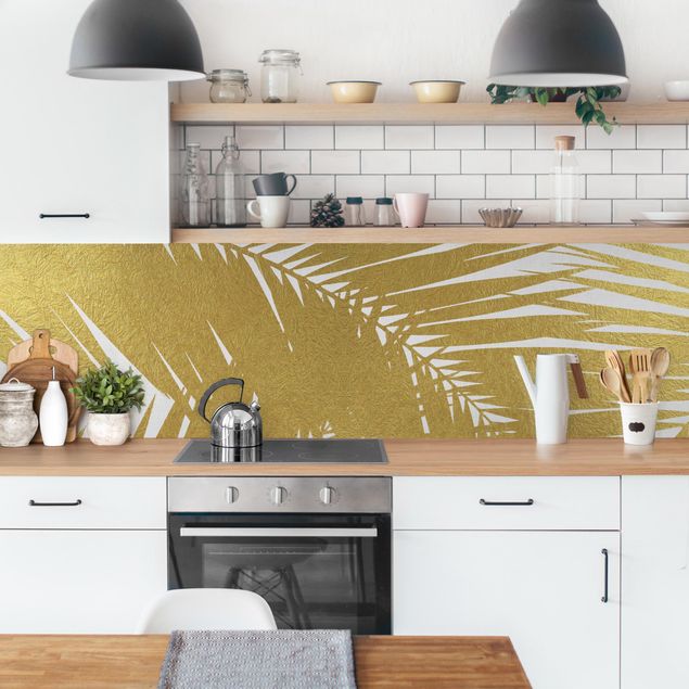 Küchenrückwand - Blick durch goldene Palmenblätter