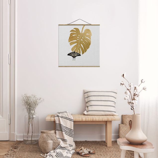 Stoffbild mit Posterleisten - Goldene Monstera mit Schmetterling - Quadrat 1:1